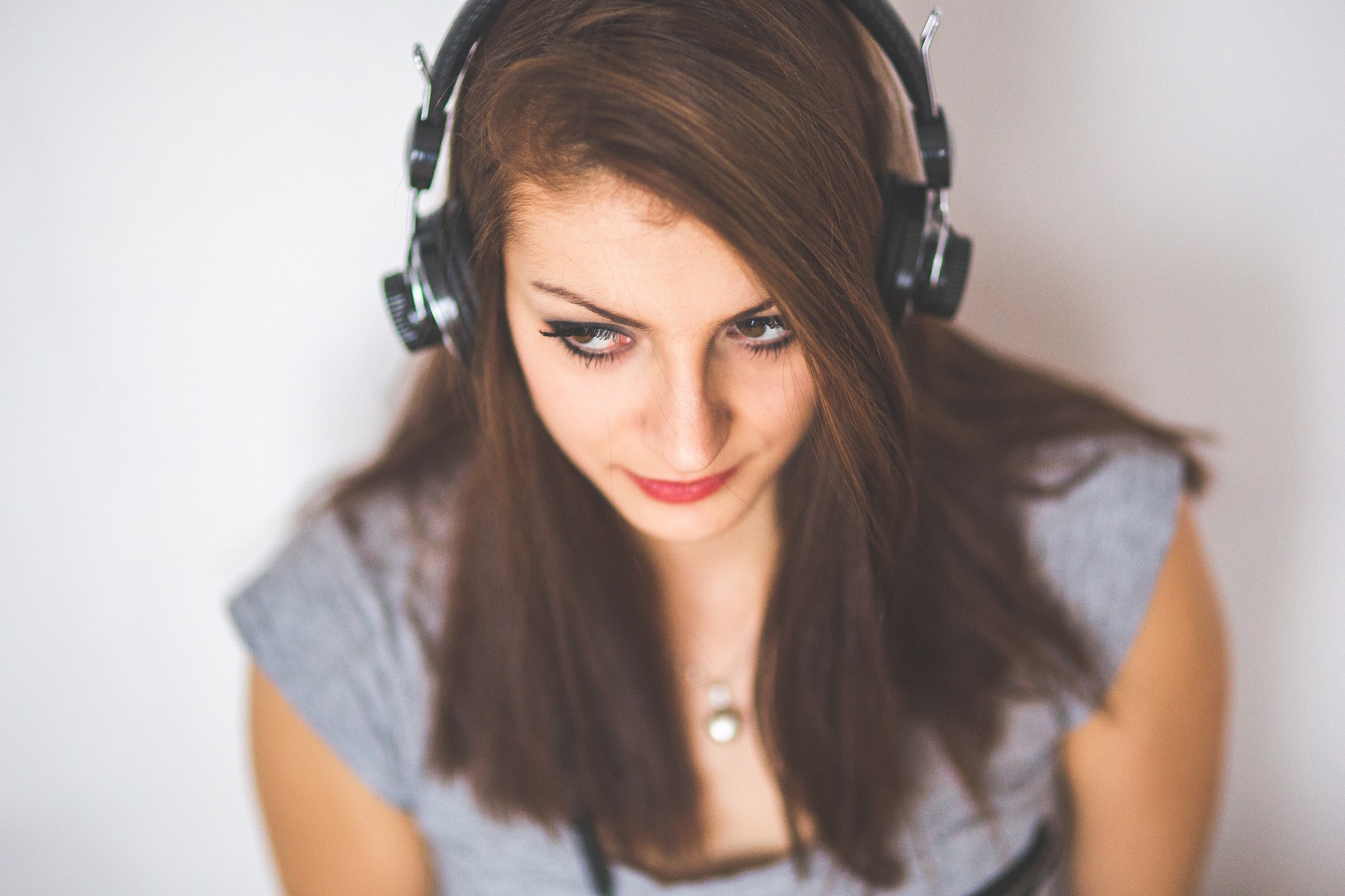 girl wearing headphones from above